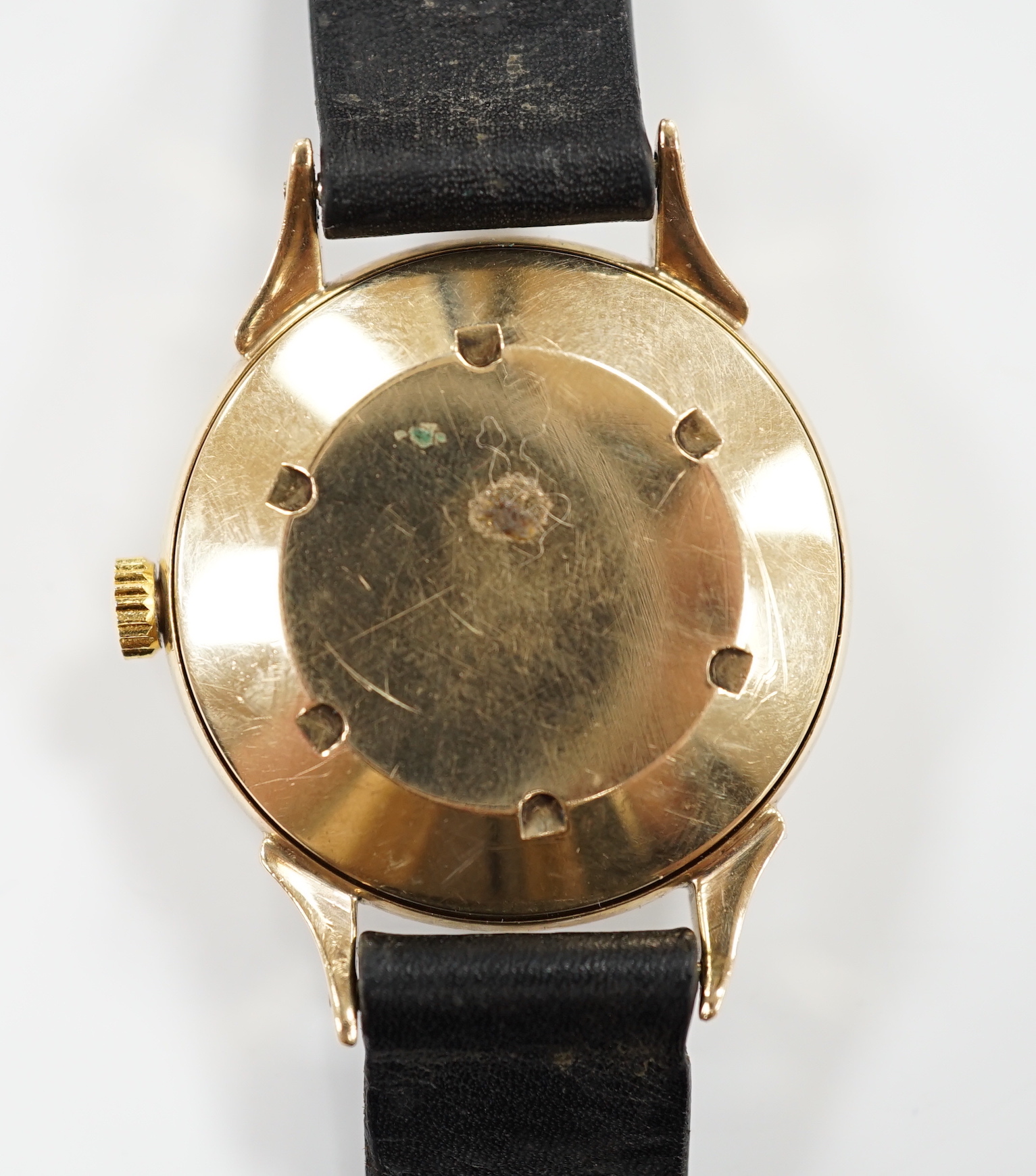 A gentleman's early 1950's 9ct gold J.W. Benson automatic wrist watch, case diameter 34mm, on associated leather strap, no buckle.